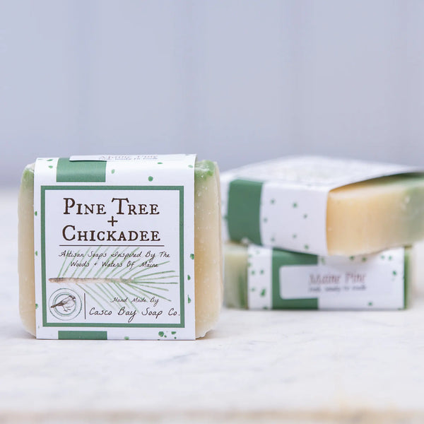 Casco Bay Soap Company bar of Maine pine soap with pine tree + chickadee design wrap