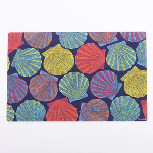 Festive Fish scallop shell design on a blue placemat, perfect for holiday table decor and festive gatherings.