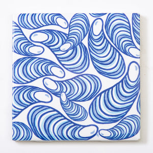 Festive Fish tile coaster featuring colorful mussel design on white background, perfect for protecting surfaces during celebrations.