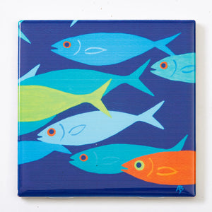 Orange ceramic tile coaster featuring a festive fish design from Festive Fish, perfect for holiday table settings.
