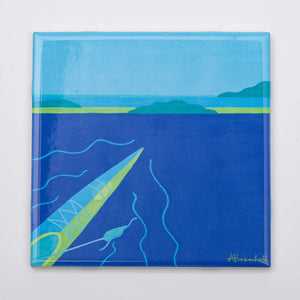 Blue kayak-themed festive trivet from Festive Fish with vibrant nautical design, perfect for holiday table decor.