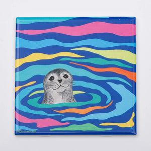 Festive Fish harbor seal trivet with colorful nautical design, perfect for holiday kitchen decor.