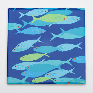 Festive Fish brand trivet featuring a colorful fish design, perfect for holiday table decor and protecting surfaces from hot dishes.