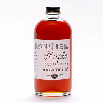 12 oz bottle of Frontier Maple Sugarworks Organic Maple Syrup with a clear glass bottle and golden syrup inside.
