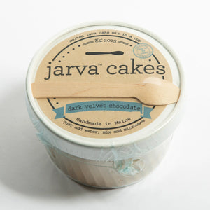 Dark velvet chocolate cake from Jarva Cakes with rich chocolate frosting and smooth texture, displayed on a plate.