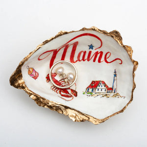 Maine oyster shell ring dish with lighthouse design by Latitude 43 Designs, featuring a coastal Portland scene.