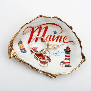 Maine oyster shell ring dish by Latitude 43 Designs featuring Quoddy Head Lighthouse and maritime-inspired decor.
