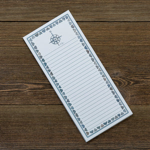 Love Rocks Notepad by Love Rocks Me featuring a compass design, ideal for jotting down notes and inspiring creativity.