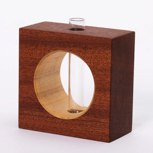 Elegant mahogany bud vase by S.E. Hall Furniture featuring a smooth, curved design perfect for small floral arrangements.