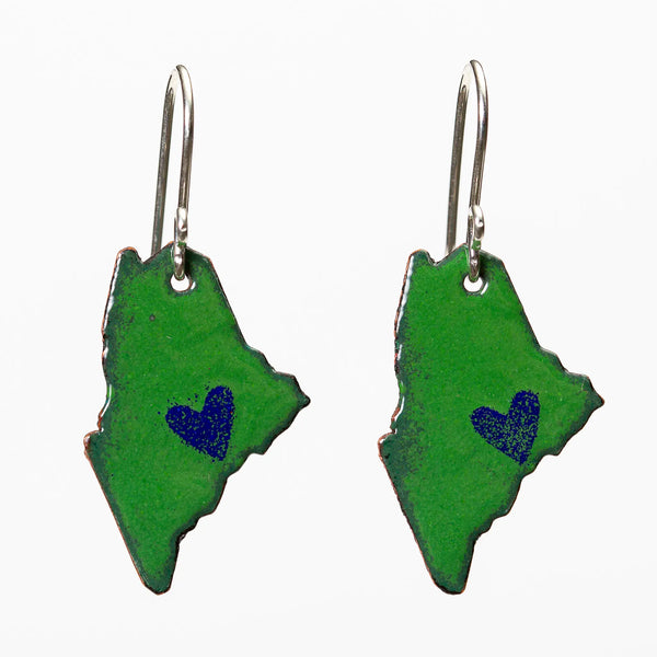 Blueberry Bay Jewelry green state of Maine copper enameled earrings hang from sterling silver ear wires and each one has a small blue heart design on the coast
