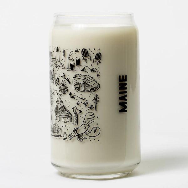 Brainstorm Maine beer can glasses showing the Maine doodles in black and filled with milk