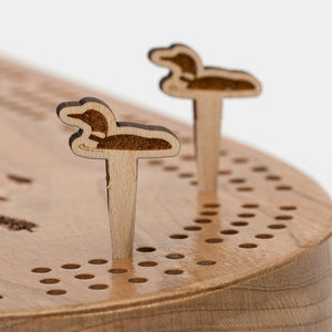 Cast & Carve Cribbage Peg Sets featuring loon-shaped pegs for traditional card game play.
