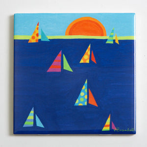 Colorful Festive Fish trivet featuring sun and sailboat design, perfect for protecting surfaces from hot dishes.