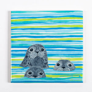Festive Fish three-seal trivets with colorful, nautical-themed design perfect for holiday kitchen decor.