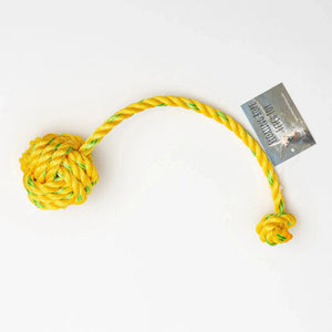 Yellow floating rope fetch toy by Fetch Me, durable and suitable for outdoor play with dogs on water and land.
