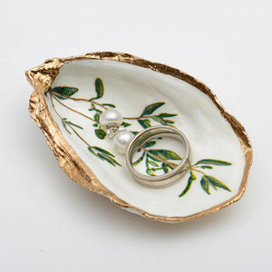Herb Oyster Shell Ring Dish by Latitude 43 Designs, showcasing a natural oyster shell with herb pattern for jewelry storage.