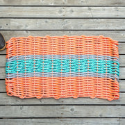Little Salty Rope lobster-themed rope mat in coral, teal, and gray featuring detailed lobster design and textured surface.