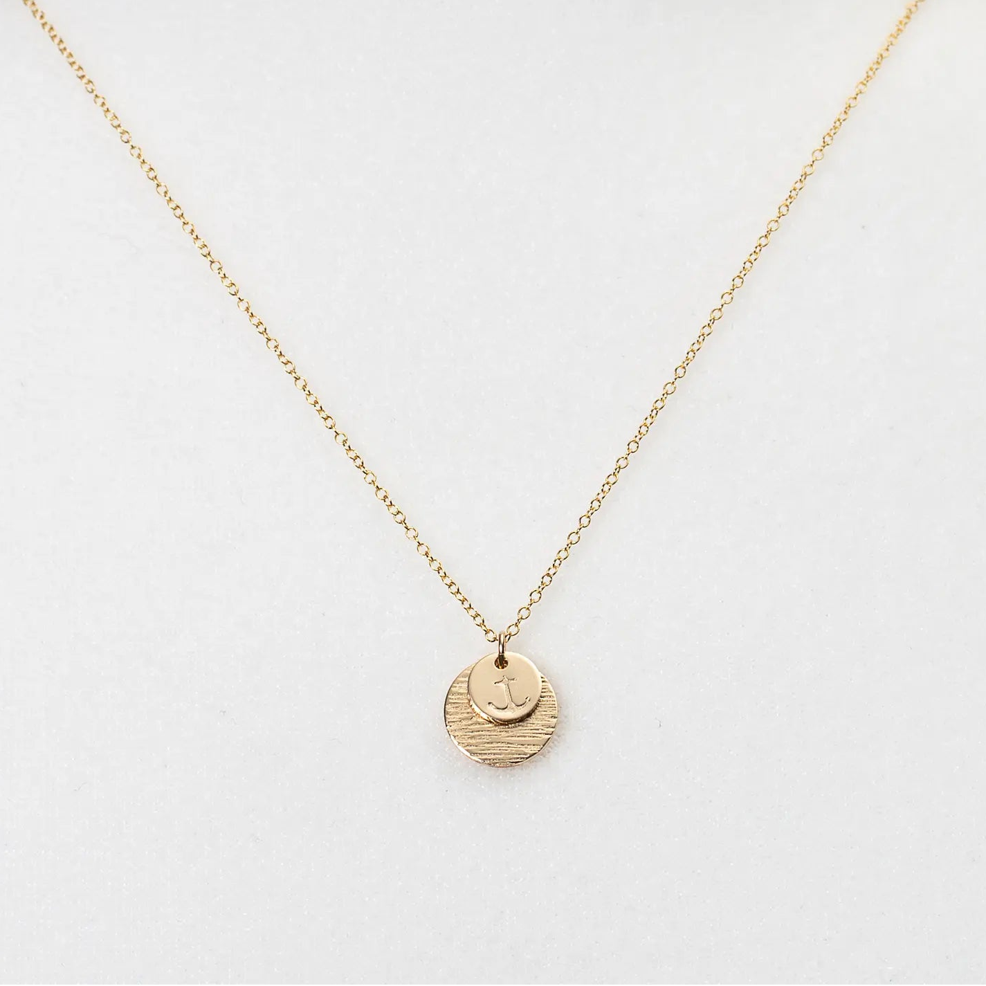 Gold Sail Away Necklace by Maine Yoga Jewelry featuring a sailboat charm on a delicate chain.