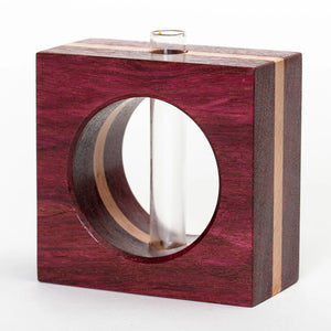 Purpleheart wood bud vase by S.E. Hall Furniture with a smooth, rounded shape and natural wood grain finish.